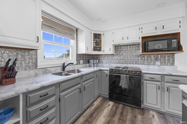 1827 N State Road 257, Otwell, IN 47564 - kitchen with electric range oven, gray cabinets, black microwave, backsplash, and light stone countertops