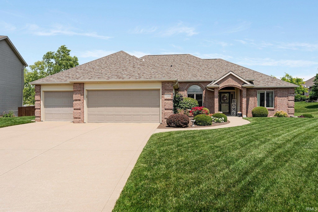 5421 Sorrento Blvd, Fort Wayne, IN 46845 - view of front of home with brick siding, a garage, and driveway