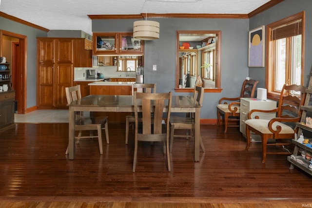 820 S High St, Bloomington, IN 47401 - dining space with crown molding and dark wood-type flooring