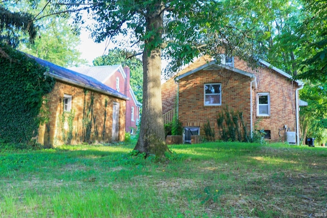808 W Linn St, Holland, IN 47541 - view of property exterior featuring brick siding and a lawn
