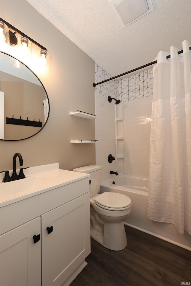 2114 S Branson St, Marion, IN 46953 - full bathroom with wood finished floors, vanity, shower / bath combo, and a textured ceiling
