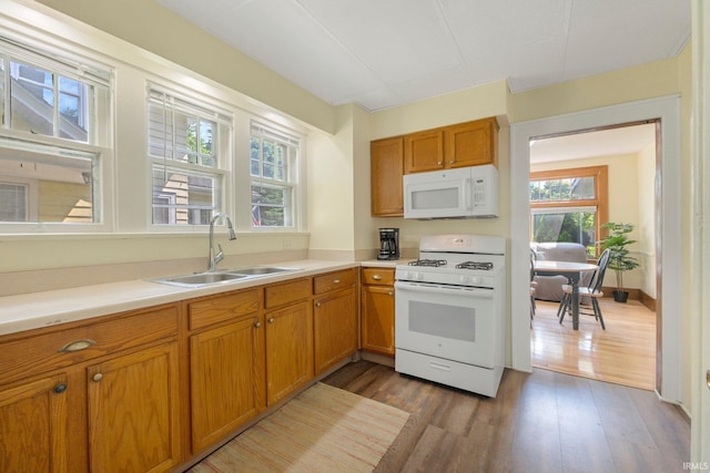 2001 N Anthony Blvd, Fort Wayne, IN 46805 - kitchen with white appliances, healthy amount of natural light, wood finished floors, and brown cabinetry