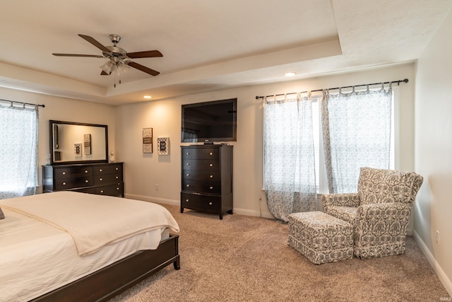 3951 W Nimita Ct, Bloomington, IN 47404 - carpeted bedroom with a tray ceiling, recessed lighting, and a ceiling fan