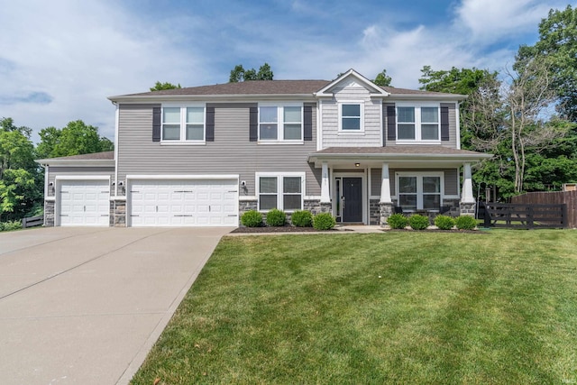 3951 W Nimita Ct, Bloomington, IN 47404 - view of front of home featuring stone siding, driveway, and a garage