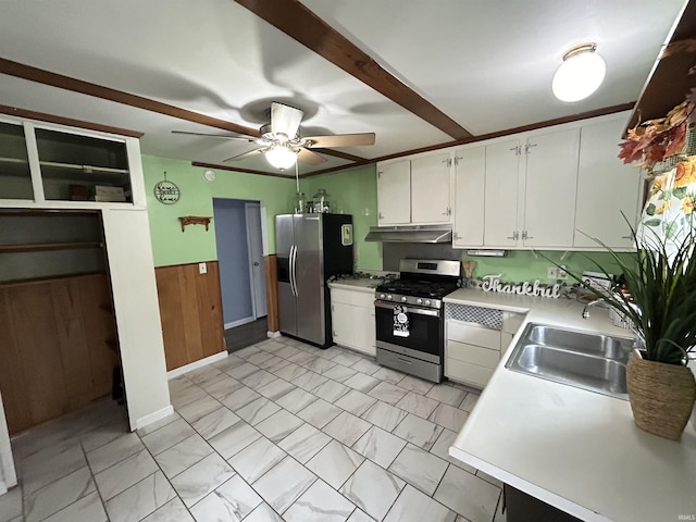 1015 Timbercrest Dr, Logansport, IN 46947 - kitchen featuring appliances with stainless steel finishes, under cabinet range hood, a ceiling fan, light marble finish flooring, and light countertops