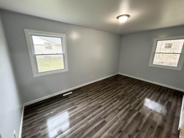 1015 Timbercrest Dr, Logansport, IN 46947 - spare room featuring dark wood-style flooring