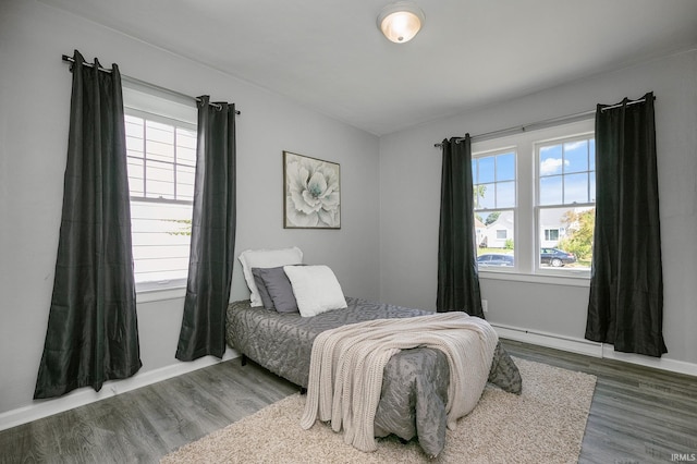 2606 Prast Blvd, South Bend, IN 46628 - bedroom with wood finished floors and a baseboard radiator