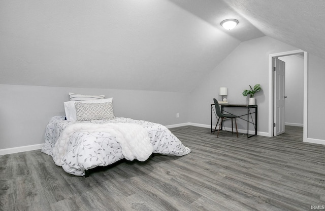 2606 Prast Blvd, South Bend, IN 46628 - bedroom featuring wood finished floors, vaulted ceiling, and a textured ceiling