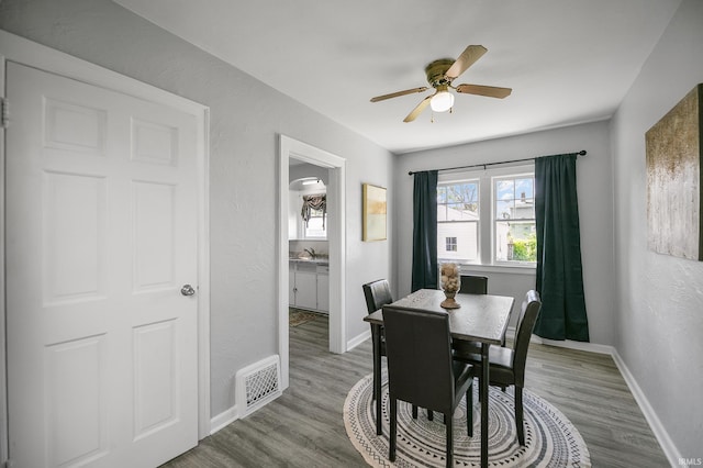 2606 Prast Blvd, South Bend, IN 46628 - dining room featuring a ceiling fan and wood finished floors