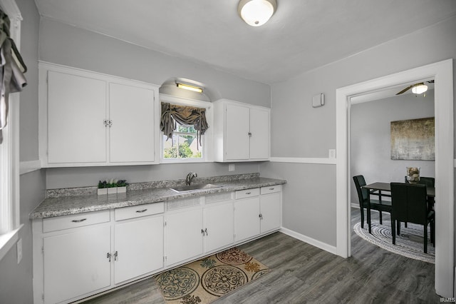 2606 Prast Blvd, South Bend, IN 46628 - kitchen featuring dark wood finished floors, white cabinets, and light countertops