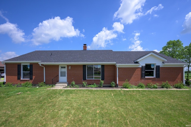 384 Chatham Ct, Union City, IN 47390 - ranch-style house featuring brick siding, a front lawn, a chimney, and roof with shingles