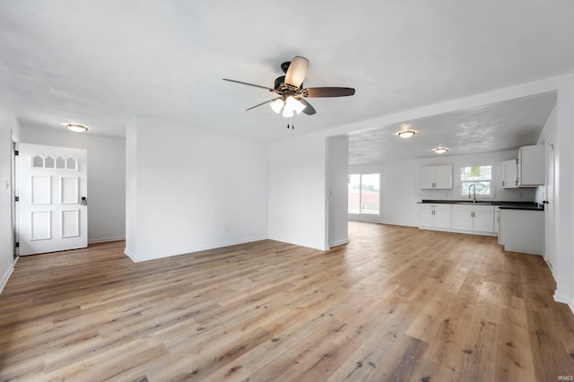 384 Chatham Ct, Union City, IN 47390 - unfurnished living room with ceiling fan and light wood finished floors