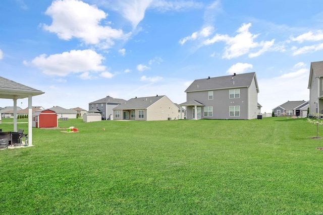 5355 Bloomsbury Ct, Newburgh, IN 47630 - view of green lawn featuring a storage shed and a residential view