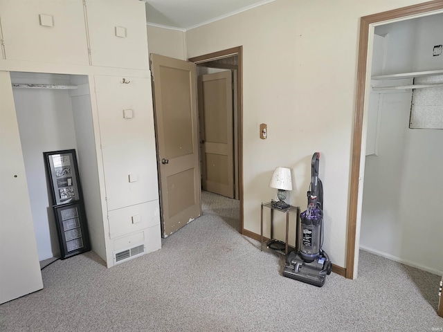 207 E Columbia St, Logansport, IN 46947 - bedroom with carpet flooring, ornamental molding, and a closet
