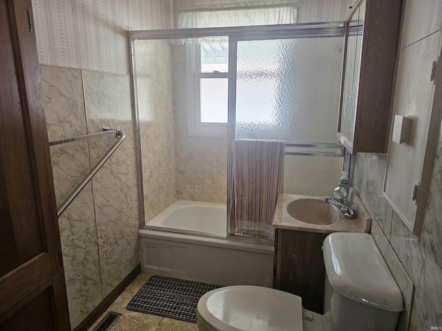 207 E Columbia St, Logansport, IN 46947 - full bathroom with enclosed tub / shower combo, wallpapered walls, and vanity