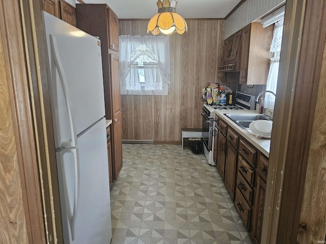 207 E Columbia St, Logansport, IN 46947 - kitchen featuring freestanding refrigerator, range, light flooring, light countertops, and under cabinet range hood
