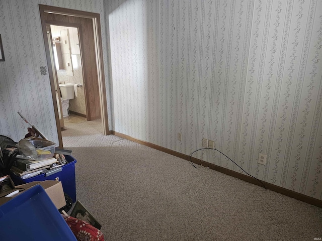 207 E Columbia St, Logansport, IN 46947 - spare room with wallpapered walls and carpet flooring
