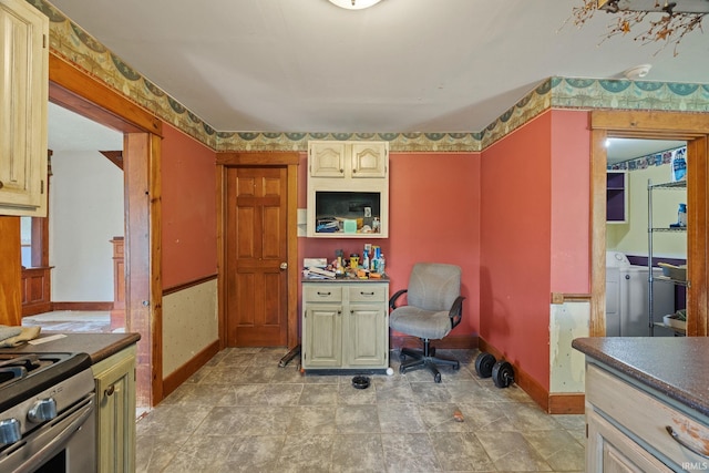 3192 N 150 W, Kokomo, IN 46901 - kitchen featuring gas stove, washer and dryer, and dark countertops