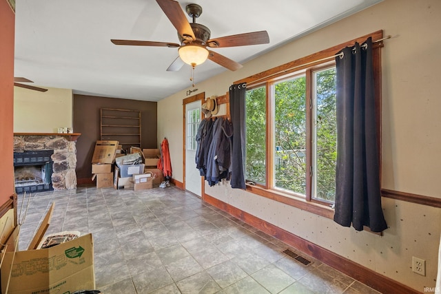 3192 N 150 W, Kokomo, IN 46901 - living room featuring ceiling fan, plenty of natural light, and a fireplace