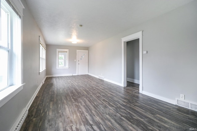 1110 Chalfant St, South Bend, IN 46617 - spare room featuring baseboard heating and dark wood-style floors