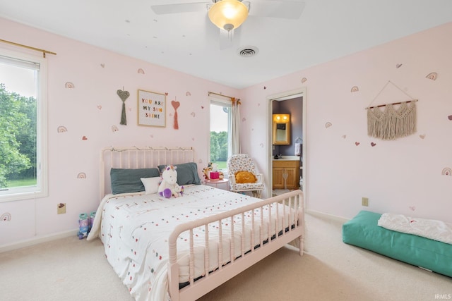 61705 Greentree Dr, South Bend, IN 46614 - carpeted bedroom with ceiling fan and connected bathroom