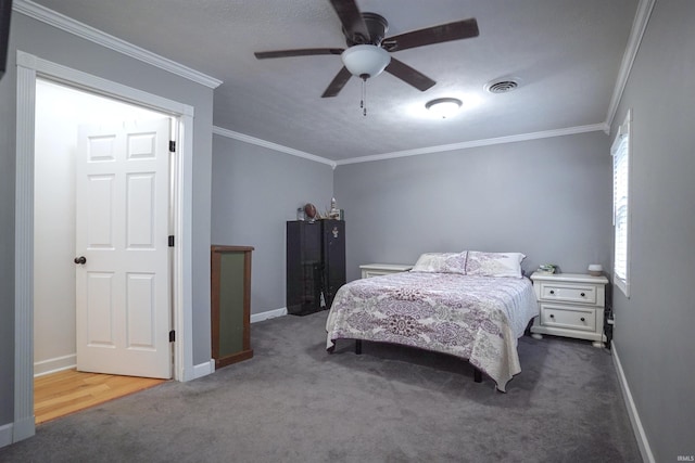8558 E John Emery Rd, New Carlisle, IN 46552 - carpeted bedroom featuring ornamental molding and a ceiling fan
