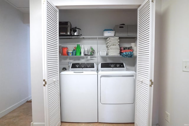 8558 E John Emery Rd, New Carlisle, IN 46552 - laundry area with washing machine and dryer and baseboards