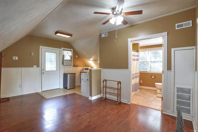 8558 E John Emery Rd, New Carlisle, IN 46552 - bonus room with wood finished floors, a ceiling fan, plenty of natural light, vaulted ceiling, and a textured ceiling