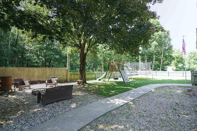 8558 E John Emery Rd, New Carlisle, IN 46552 - fenced backyard with a playground and a trampoline