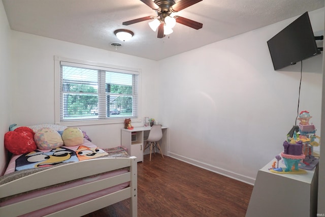 8558 E John Emery Rd, New Carlisle, IN 46552 - bedroom featuring dark wood finished floors, a ceiling fan, and a textured ceiling