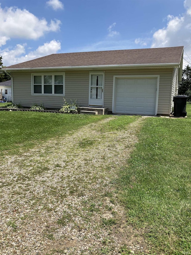 402 Charles St, Union City, IN 47390 - ranch-style house with driveway, a front lawn, and a garage