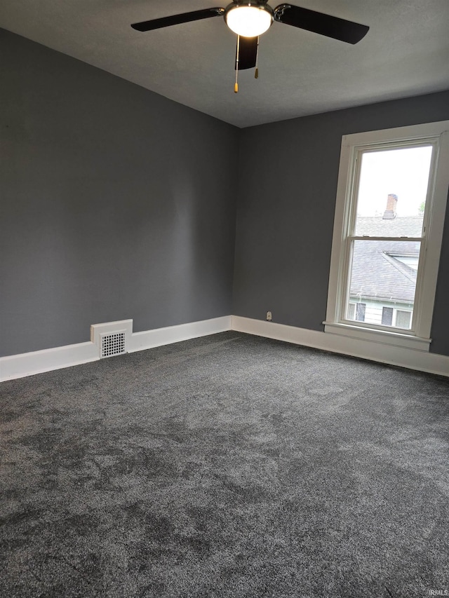 817 Mason St, Elkhart, IN 46516 - spare room featuring ceiling fan and carpet floors