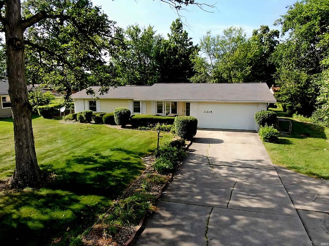 3315 E Paulding Rd, Fort Wayne, IN 46816 - view of front of house featuring an attached garage, concrete driveway, and a front lawn