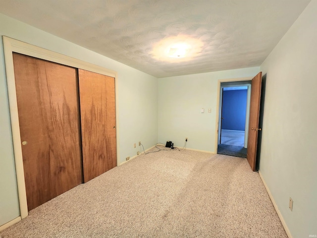 3315 E Paulding Rd, Fort Wayne, IN 46816 - unfurnished bedroom with a closet, carpet, and a textured ceiling