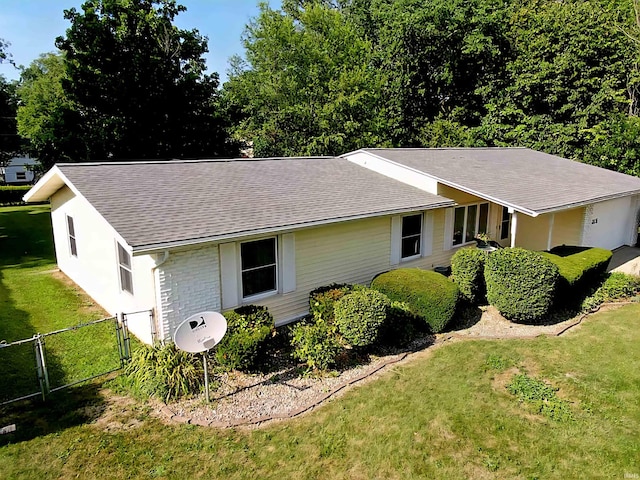3315 E Paulding Rd, Fort Wayne, IN 46816 - view of side of property featuring a gate and roof with shingles