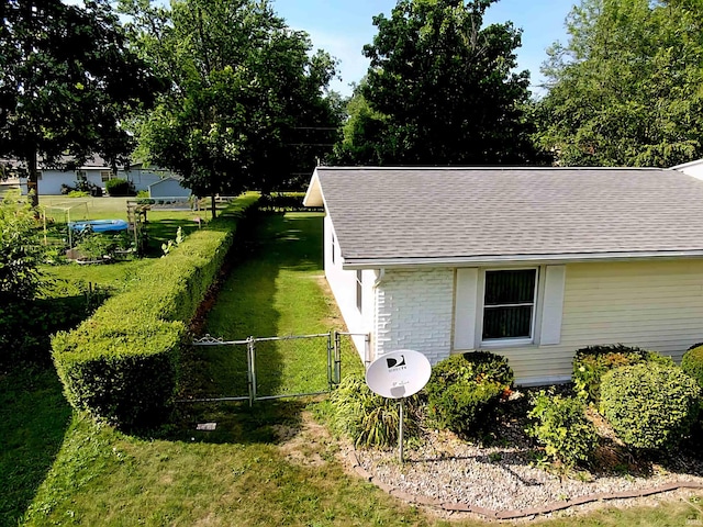 3315 E Paulding Rd, Fort Wayne, IN 46816 - view of side of home featuring roof with shingles and a gate