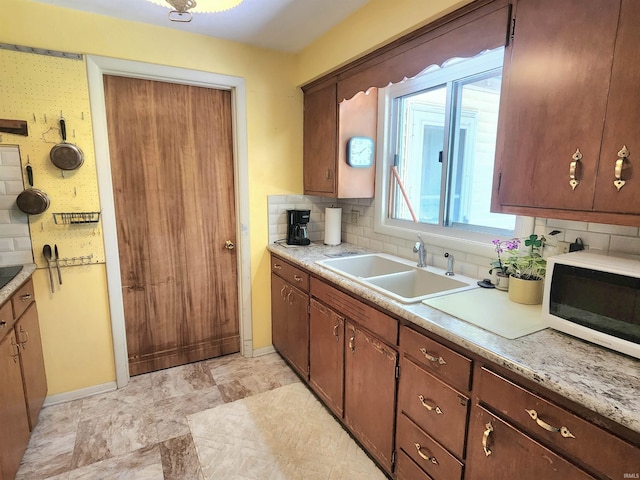 3315 E Paulding Rd, Fort Wayne, IN 46816 - kitchen featuring decorative backsplash and light countertops