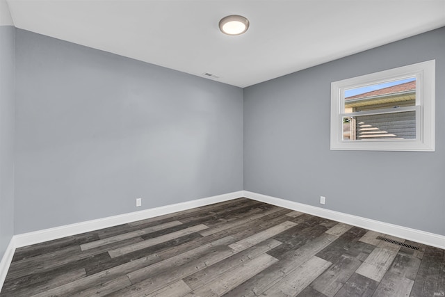 1204 Holly Dr, Lafayette, IN 47909 - unfurnished room featuring dark wood-type flooring and baseboards