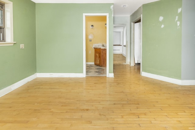 1121 W Grant St, Ellettsville, IN 47429 - unfurnished room featuring light wood-type flooring and baseboards
