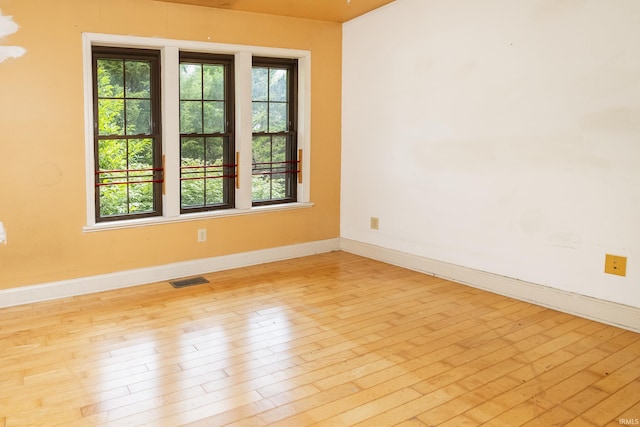1121 W Grant St, Ellettsville, IN 47429 - unfurnished room with baseboards and wood-type flooring