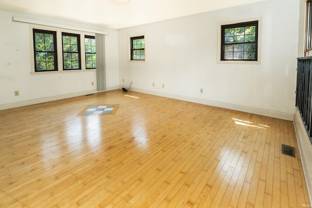 1121 W Grant St, Ellettsville, IN 47429 - spare room featuring light wood-type flooring and baseboards