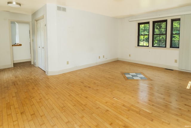 1121 W Grant St, Ellettsville, IN 47429 - empty room with light wood-style floors and baseboards