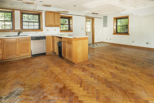 1121 W Grant St, Ellettsville, IN 47429 - kitchen featuring stainless steel dishwasher, a peninsula, light countertops, and plenty of natural light