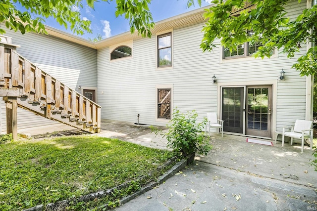 1121 W Grant St, Ellettsville, IN 47429 - rear view of house with a patio area