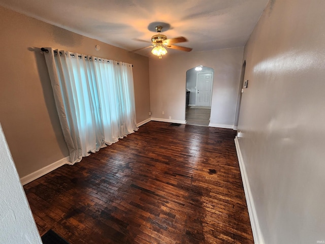 2206 S Hackley St, Muncie, IN 47302 - empty room featuring arched walkways, wood-type flooring, and a ceiling fan