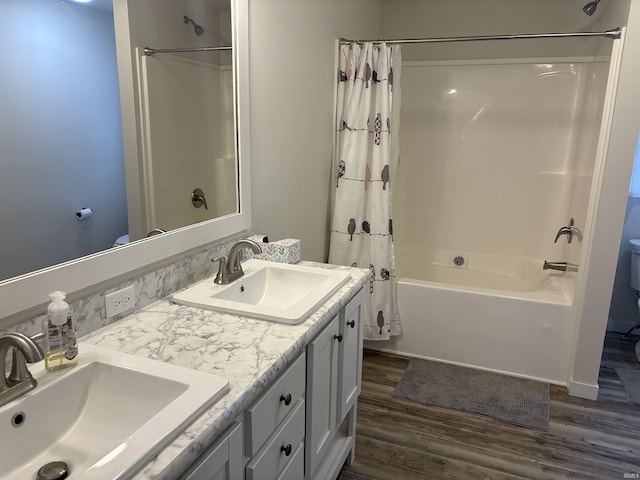 7775 N Hudson Ln, Solsberry, IN 47459 - full bathroom with wood finished floors, shower / bathtub combination with curtain, and double vanity