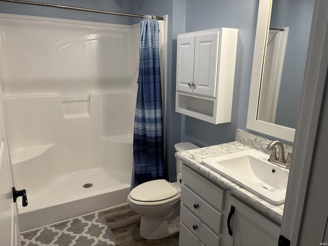 7775 N Hudson Ln, Solsberry, IN 47459 - full bathroom with wood finished floors, vanity, and a shower with curtain