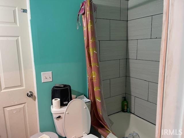 1919 Fletcher St, Anderson, IN 46016 - bathroom with shower / bath combination with curtain and toilet