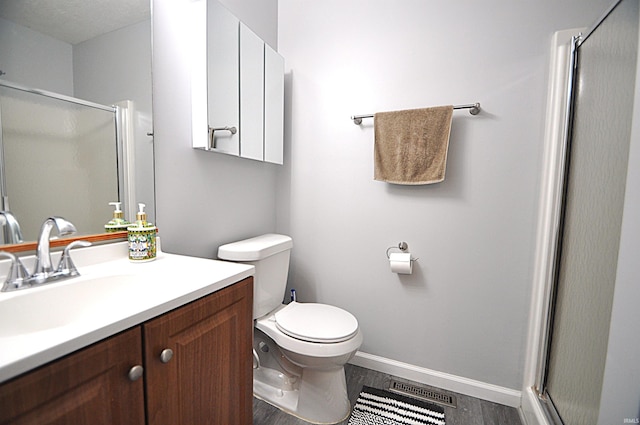 21573 Kern Rd, South Bend, IN 46614 - full bathroom with a stall shower, vanity, and wood finished floors