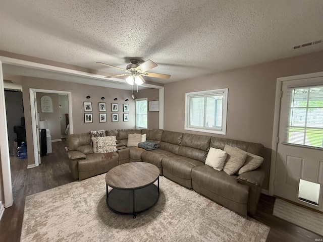 308 E Fourth St, North Webster, IN 46555 - living room featuring a textured ceiling, wood finished floors, and a ceiling fan